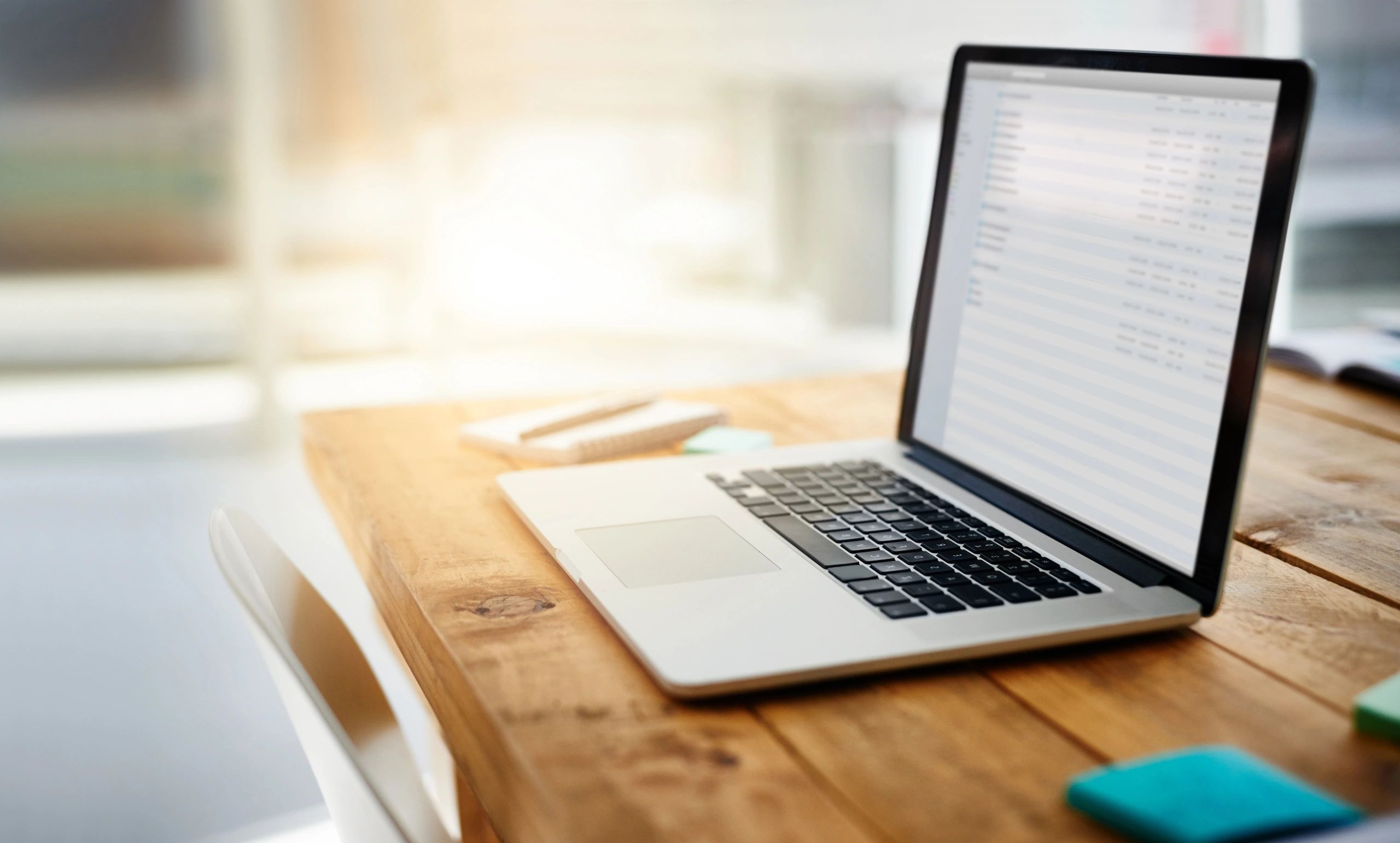 Laptop on a modern desk representing email and workflow
